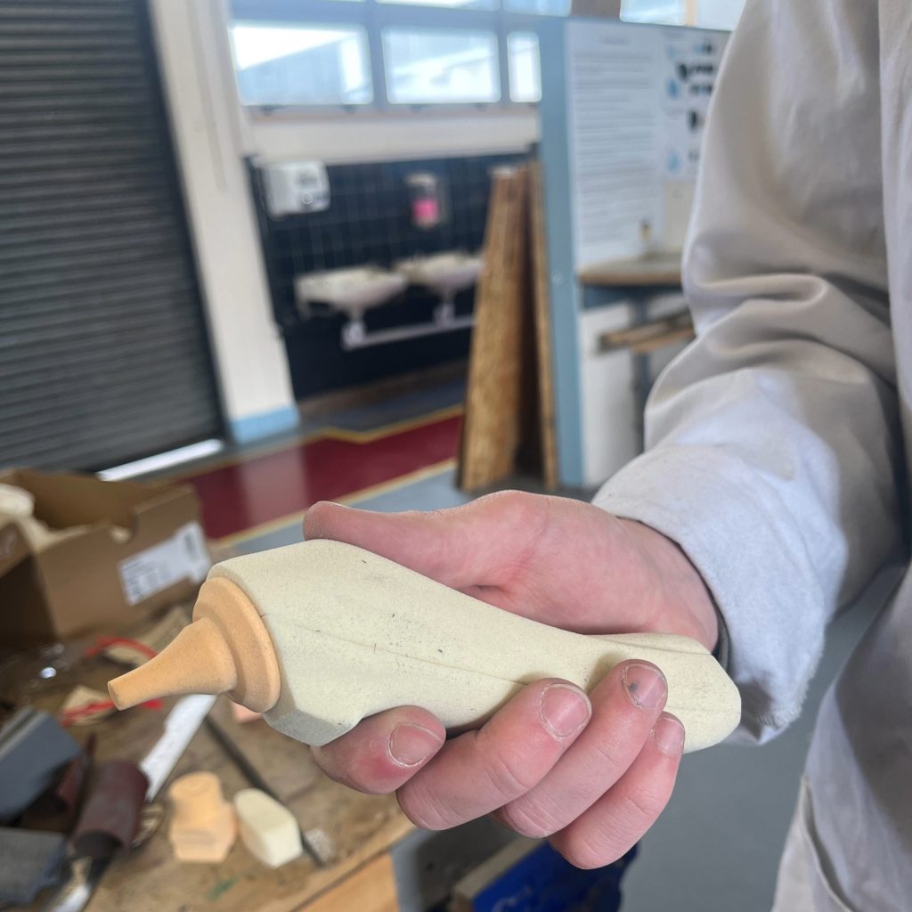 Undergraduate product design student shaping a physical prototype during studio practice at SETU